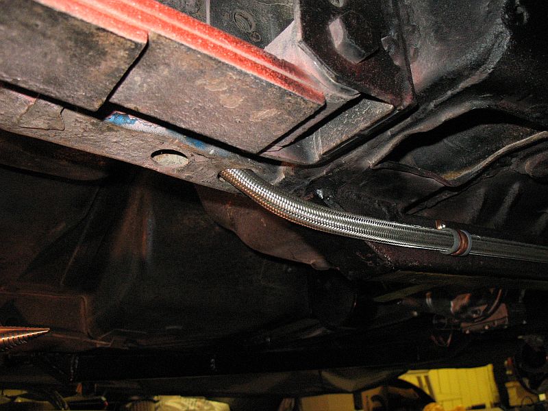 It now goes into the rear chassis leg from the chassis connector.