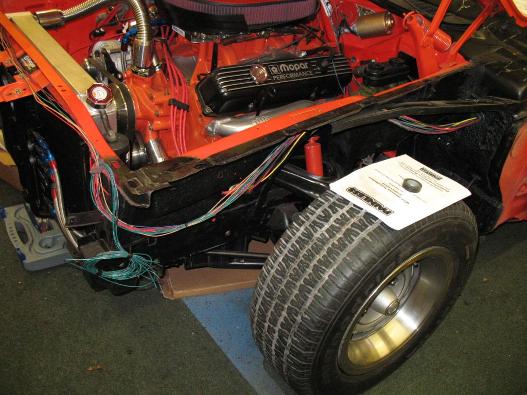 Starter and charging system wires are going behind the fender. Along with the harness for the front lights.