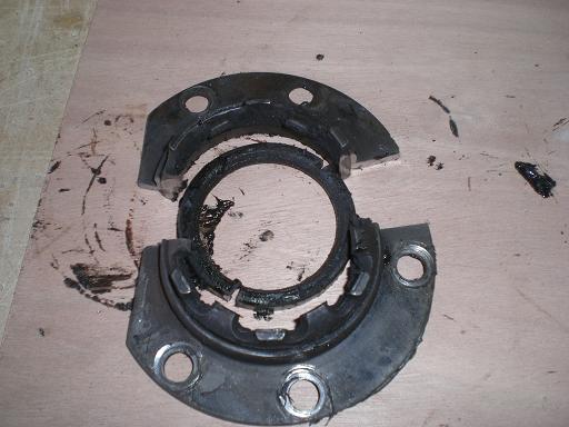 grind at 0' and 180' through axle retaining plate and remove