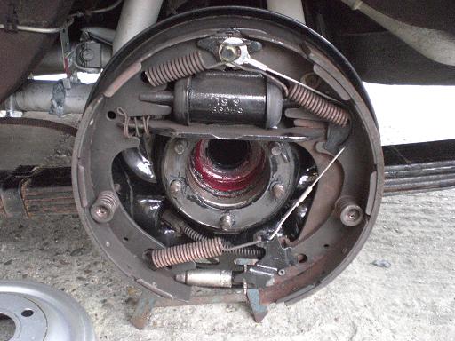 Jack one side up remove wheel and unbolt the half shaft and withdraw it carefully