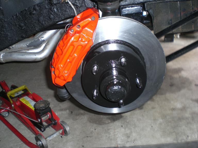 calipers and discs mounted to the car