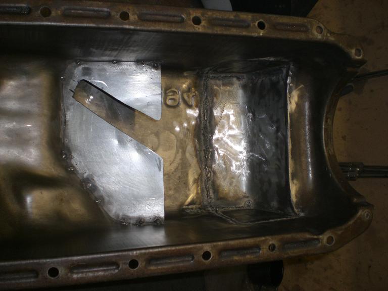 Baffle added to stop oil moving to the back of the sump under hard acceleration