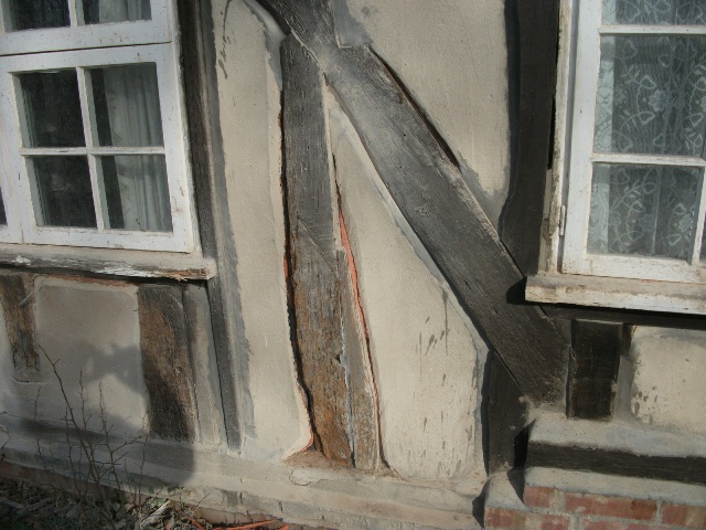An example of the beams cut back to reveal the orange &amp;quot;period&amp;quot; Royston Fertilizer Company plasic bags used for insulation....