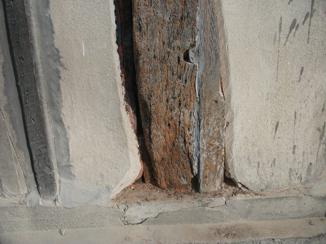 You can see how the render has been cut back and the wood taken back to solid material ready for back-filling