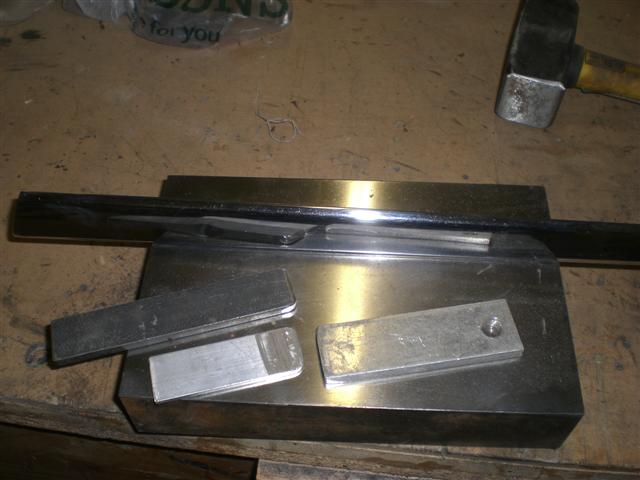 My dent removal tools. Solid flat steel table and some home made drifts out of steel and ali