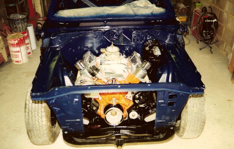 next time we turned up the engine bay had been painted as had the rest of the car, so in with the engine