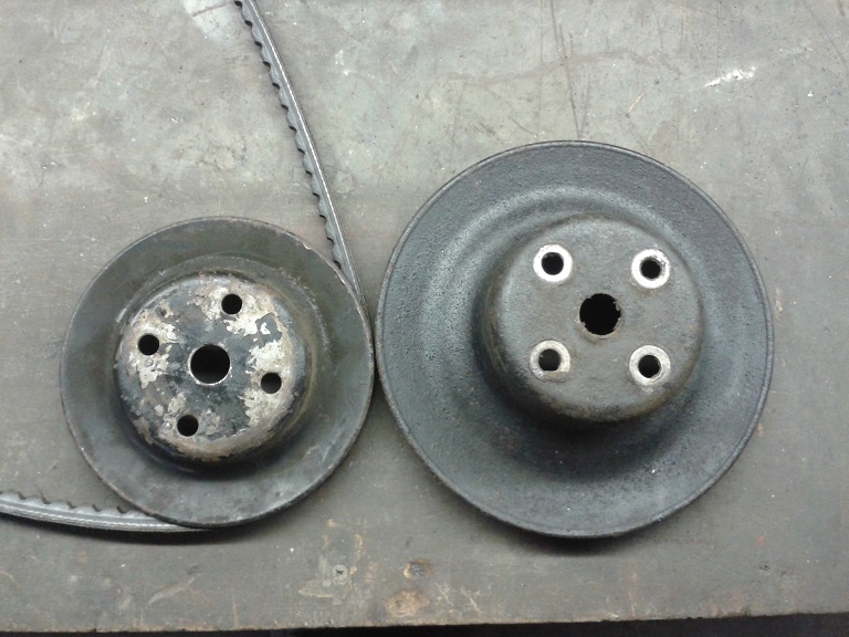 New non a/c water pump pulley on the right which is deeper in depth
