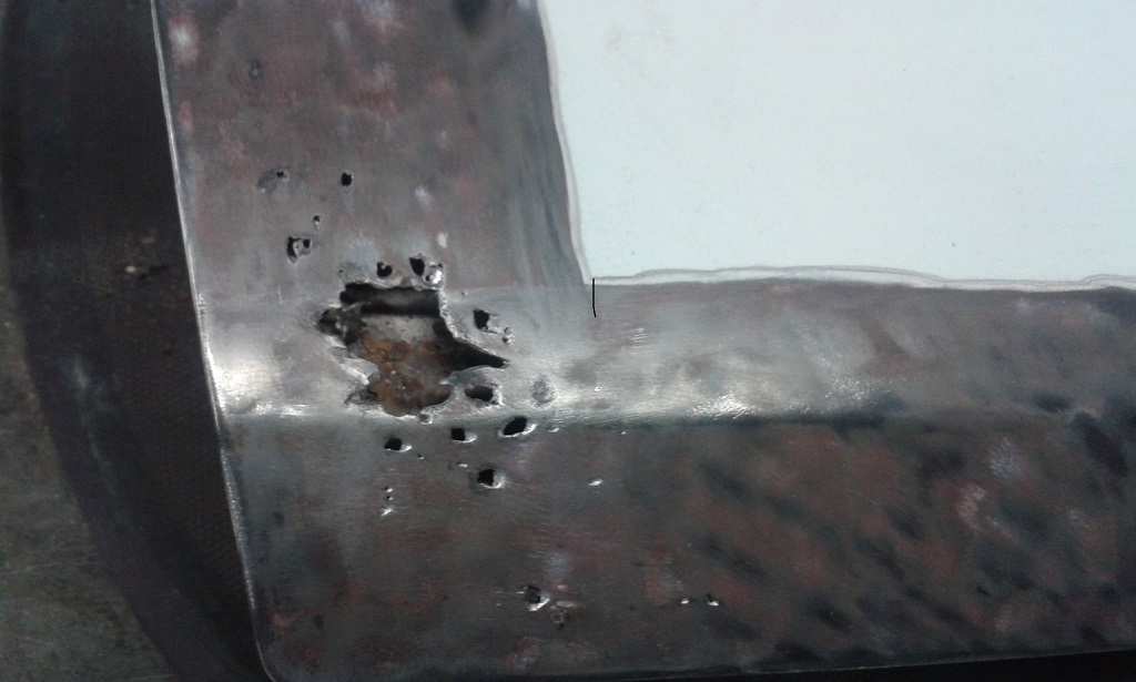 Bottom rear of Passenger Door.