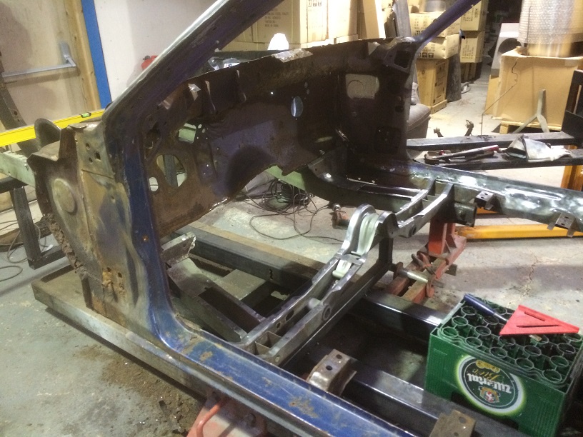 Test fit of replacement frame rails and cross member, old one cam out with some of the inner sill so they have been cut and patched.