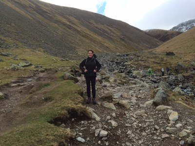 Liz. Standing on a Hill,  could be anywhere really, apart from a town, no buses no shops....
