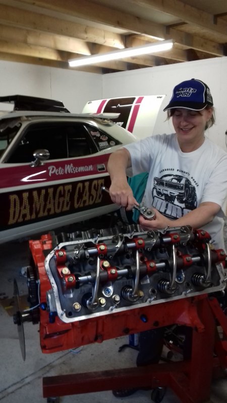 Julie repairing the Hemi - small.jpg