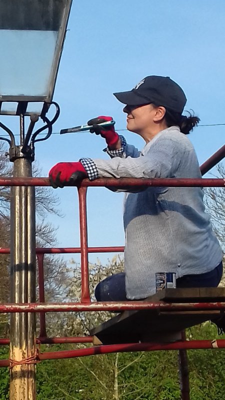 Julie painting the lamppost.jpg