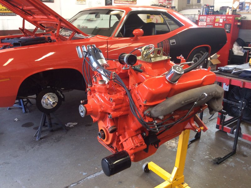 Engine out, pre-strip down. More oil leaks than first realised! And no, I don't know whose cuda that is!